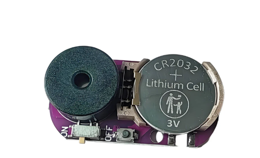 Cricket noise prank device circuit board with CR2032 lithium cell and speaker component.